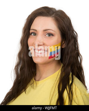 Jeune fille avec le drapeau de l'Equateur dans son visage peint Banque D'Images