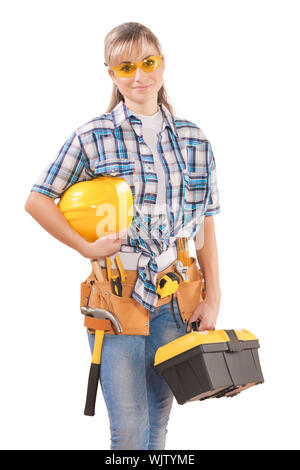 Belle femme portant des vêtements de travail avec des outils isolé sur fond blanc Banque D'Images