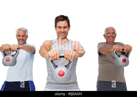 Portrait de trois hommes s'exercer avec électrique cloches over white background Banque D'Images