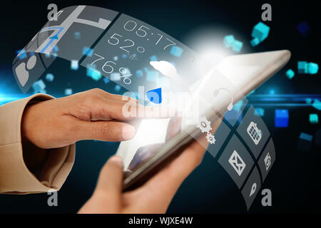 Digital composite of businesswoman touching tablet avec l'interface de l'app Banque D'Images