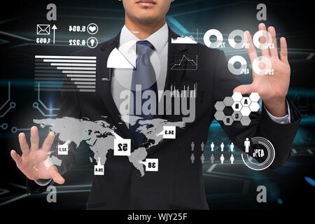 Composite de businessman touching Digital interface graphique avec la terre Banque D'Images