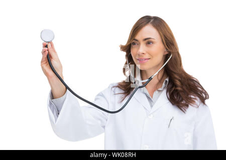 Smiling doctor holding stethoscope Banque D'Images