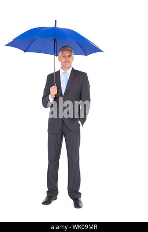 Businessman smiling at camera et tenue bleu Banque D'Images