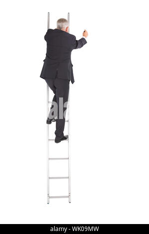 Mature businessman climbing career ladder Banque D'Images