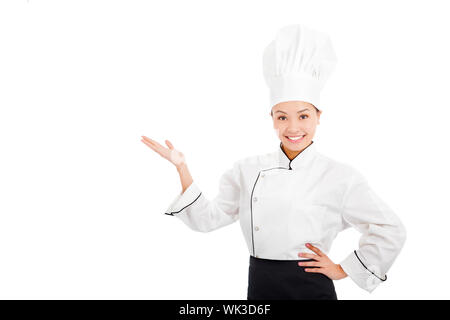 Femme cuisinière professionnelle lever les mains pour montrer quelque chose Banque D'Images