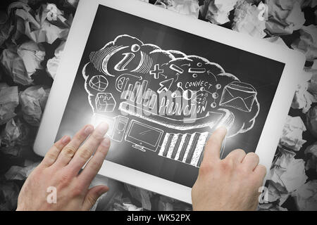 Image composite de hand touching tablet showing business brainstorm doodle Banque D'Images