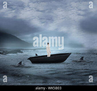 Composite image of asian businesswoman in un voilier d'être encerclé par des requins Banque D'Images