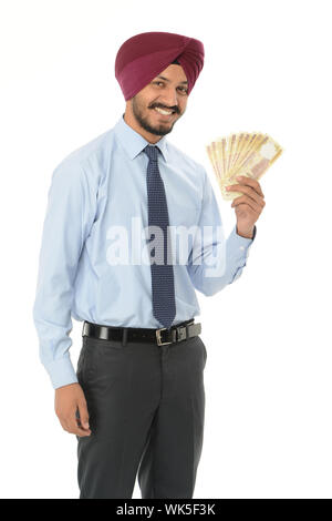 Businessman showing roupies indiennes banknote Banque D'Images