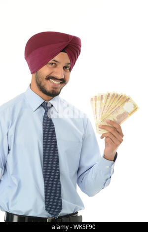 Businessman showing roupies indiennes banknote Banque D'Images