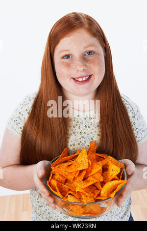 Enfant obèse mangeant Junk Food Banque D'Images