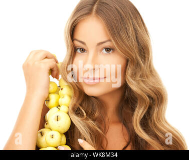 Photo de femme charmante avec apple twig Banque D'Images