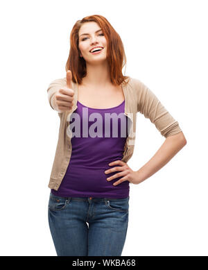 Les gestes et les gens heureux concept - smiling girl in casual clothes showing Thumbs up Banque D'Images