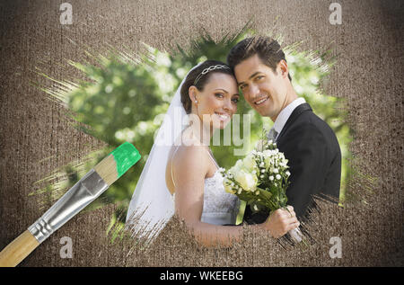 Image composite de newlyweds smiling at camera avec le pinceau imbibé de vert sur la surface altérée Banque D'Images