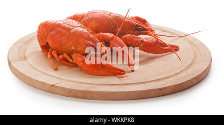 Bouillie rouge isolé sur la planche de bois crawfishes Banque D'Images