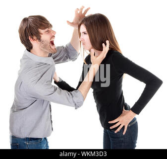 Young Caucasian woman holding son petit ami ou mari par son col Banque D'Images