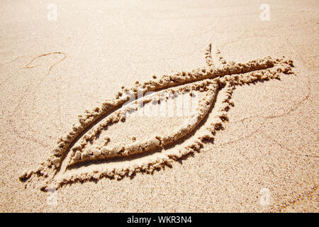 Symbole de sable de poisson Banque D'Images