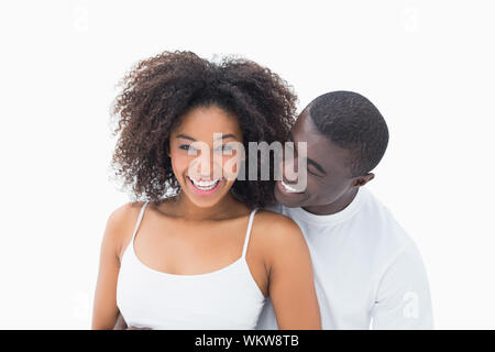 Beau couple de vêtements smiling at camera sur fond blanc Banque D'Images