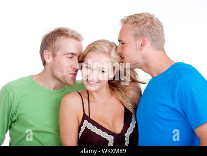 Deux jeunes hommes en train de flirter avec une femme debout entre eux - isolated on white Banque D'Images