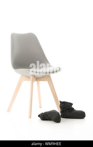 Jambe de bois conceptuel Président et des bottes noires isolé sur fond blanc. Banque D'Images