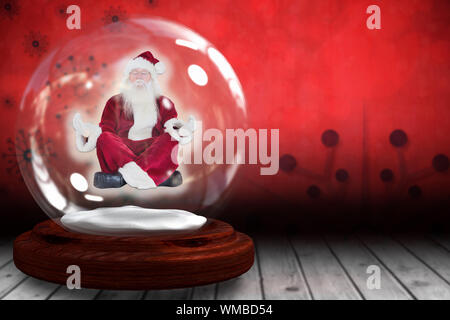 Santa at snow globe contre un plancher sur fond d'flocon Banque D'Images