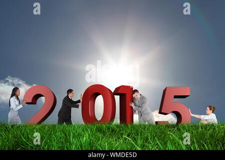 Portrait of a handsome businessman pushing a wall against sky Banque D'Images