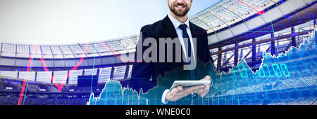 Image composite de portrait of smiling businessman holding digital tablet Banque D'Images
