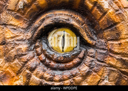 Chasseurs de dinosaures sont horribles avec les yeux jaunes. Banque D'Images