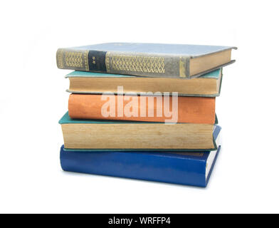 Pile de livres multicolores isolé sur blanc. Banque D'Images