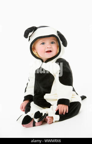 Bébé en costume de vache Banque D'Images