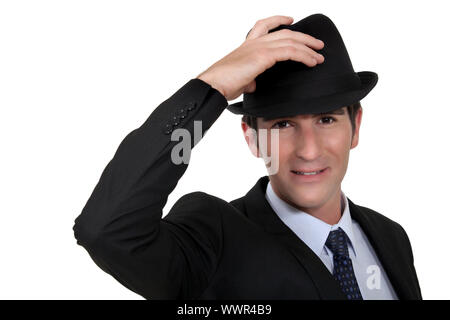 Businessman wearing trilby Banque D'Images