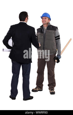 Artisan et businessman shaking hands Banque D'Images