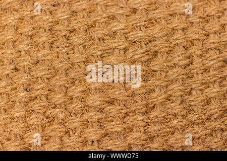 La texture de fond de matériaux naturels nattes, fibre de chanvre cannabis. Matériau tissé à partir de chanvre naturel. Le tissage de nattes de texture épaisse de threads yell Banque D'Images