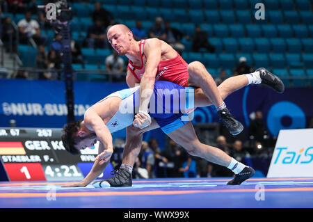 Nur sultan, le Kazakhstan. 16 Sep, 2019. Wrestling/Championnat du monde gréco-romain :, 67 kg/hommes, gréco-romain. Frank Stäbler (o) de l'Allemagne dans l'action contre l'Avocat Hansu coréen Ryu. Credit : Kadir Caliskan/dpa/Alamy Live News Banque D'Images