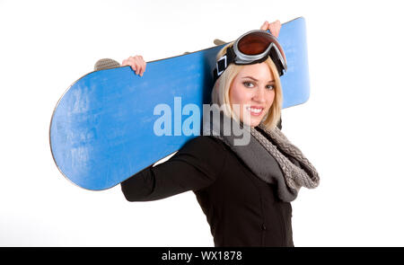 Une belle blonde femme pose avec son Snowboard Banque D'Images