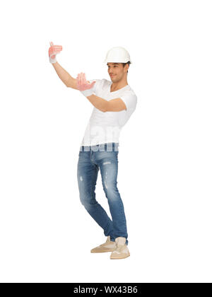 Image lumineuse de handsome builder en casque. Banque D'Images