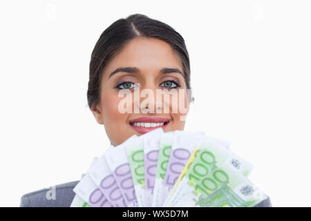 Close up of female entrepreneur avec des billets de banque sur un fond blanc. Banque D'Images