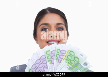 Close up of female entrepreneur avec de l'argent sur un fond blanc. Banque D'Images