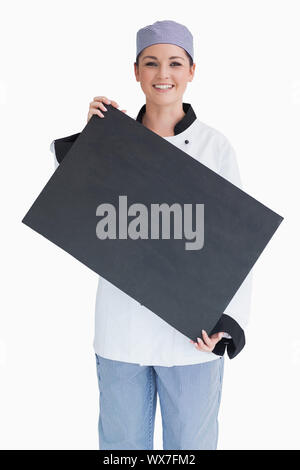 Chef holding blank blackboard Banque D'Images