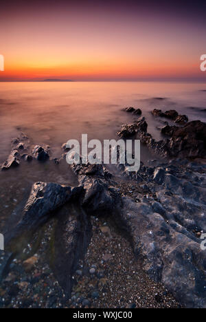 Le lever du soleil sur la mer d'Irlande à Malahide, République d'Irlande Banque D'Images