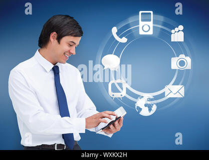 Businessman using tablet avec applications sur fond bleu Banque D'Images