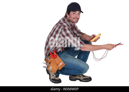 Electrician holding un outil Banque D'Images