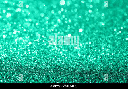 Composizione astratta. Verde menta glitter sfondo luminoso con un bellissimo bokeh di fondo Foto Stock