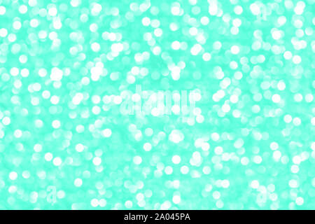 Moderno e bellissimo sfondo olografico di holiday lights bokeh di fondo in un elegante color menta. Wallpaper design. Foto Stock