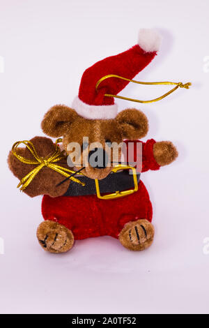 Orsacchiotto di peluche albero di Natale figura vestita come babbo natale Foto Stock