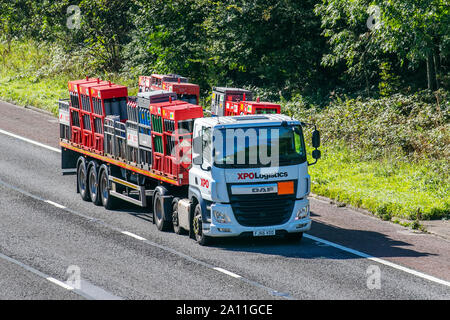 XPO logistica il trasporto di gas industriali: pesanti di merci alla rinfusa camion di consegna trasporti, autocarro, trasporto, carrello, cargo, VEICOLO DAF, consegna, trasporti, industria, catena di trasporto su rimorchio M6 a Lancaster, Regno Unito Foto Stock