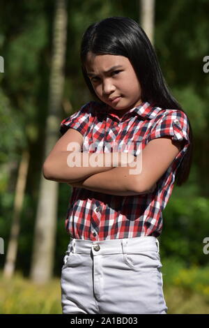 Un testardo Petite femmina Foto Stock