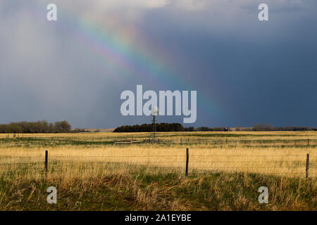 Rainbow su terre Nebraska Foto Stock