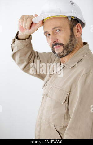 L'uomo builder in hard hat Foto Stock