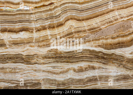 Onyx texture di pietra naturale, sfondo marrone. Foto Stock