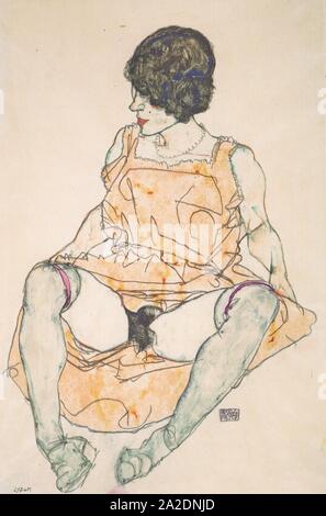 Egon Schiele - Sitzende Frau mit hochgeschobenem Kleid - 1914. Foto Stock